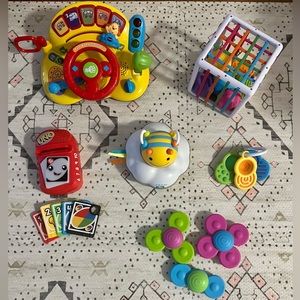 Toy box bundle including Fatbrain, Skip Hop, and Vtech toys for ages 6 mos-1 yr